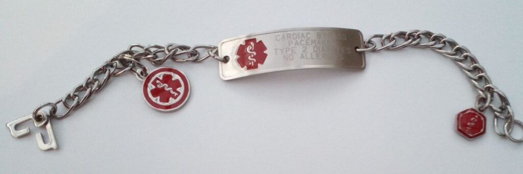 A medical alert bracelet with a red medical symbol, engraved with its wearer's conditions