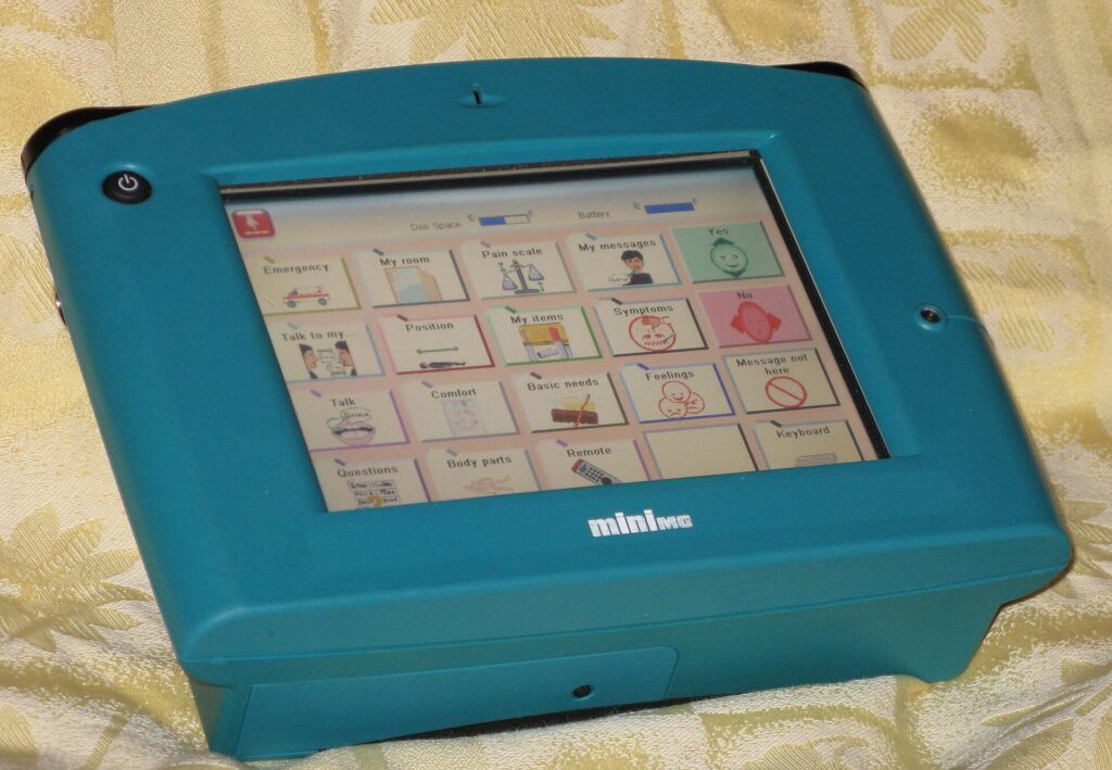 A handheld communication device with a grid of picture symbols on its screen