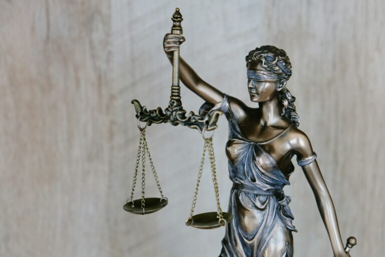 A statue of Lady Justice holding balanced scales